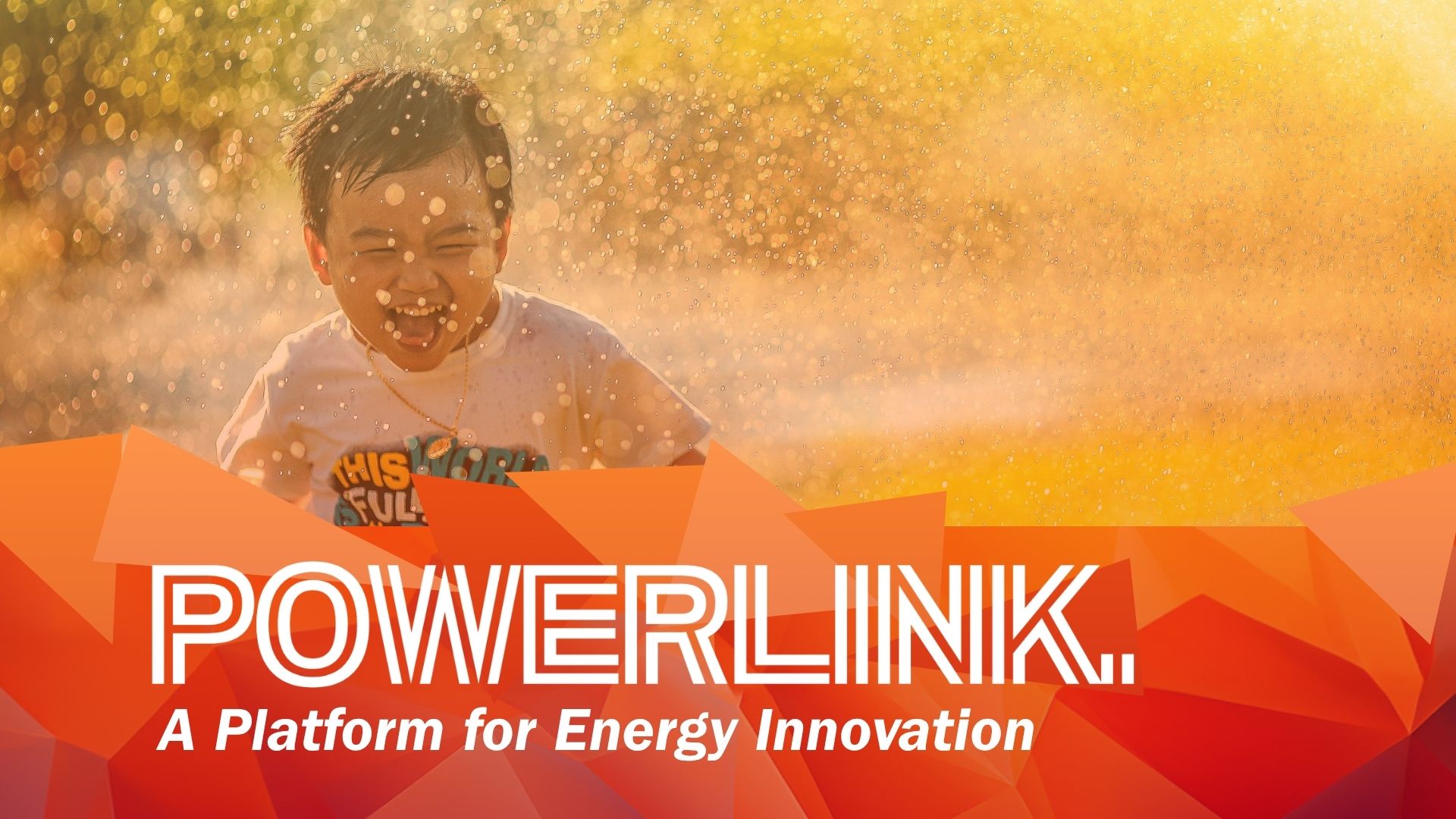 photoog young boysrunning through sprinkling water, symbol forPowerLink Project